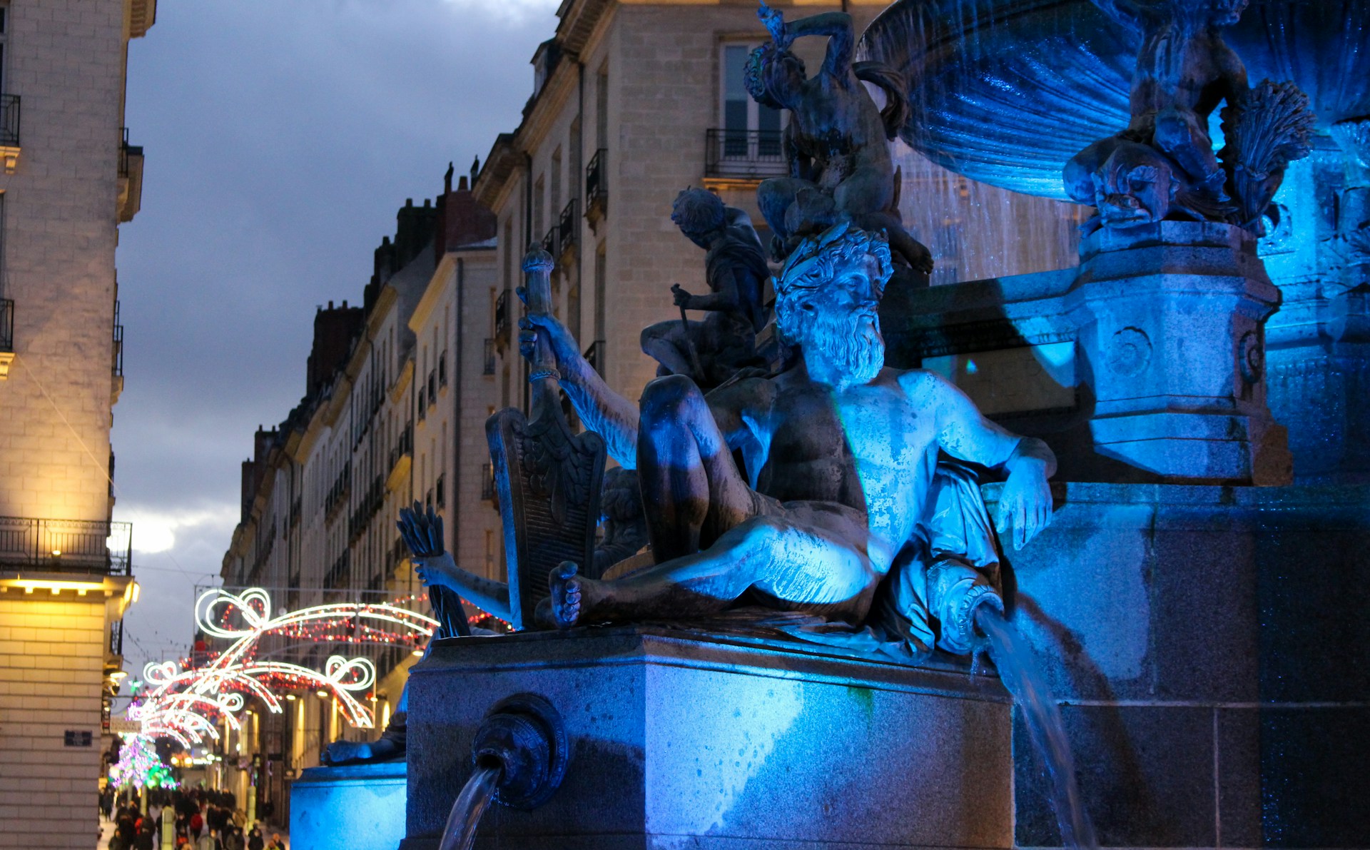 An illuminated fountain at night